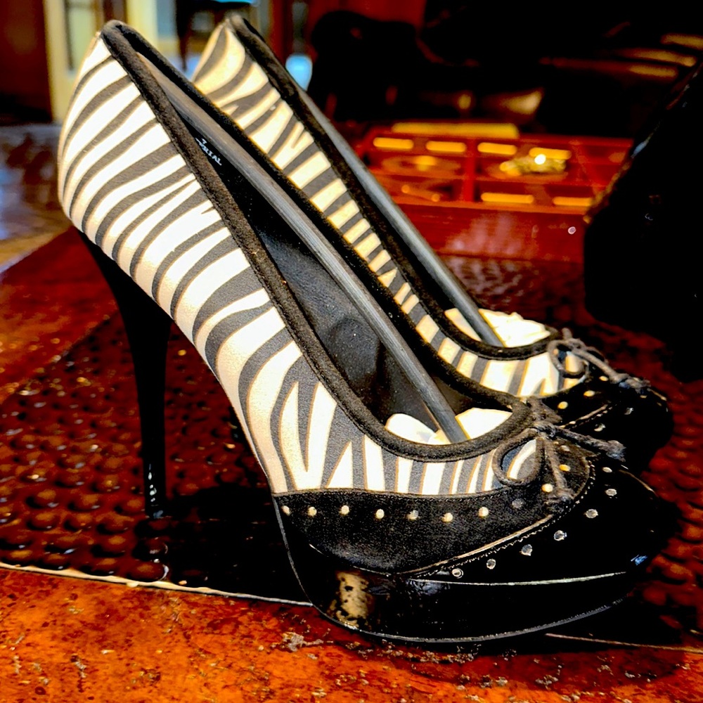 Size 7. Zebra print with patent leather trim, some scuffs from being stored.